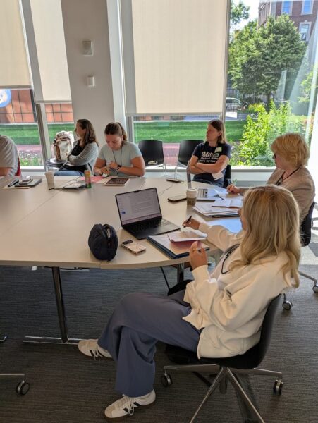 A mix of high school teachers, college professors and current Honors Program students met during the 2026 Reacting to the Past Summer Institute in New York City.